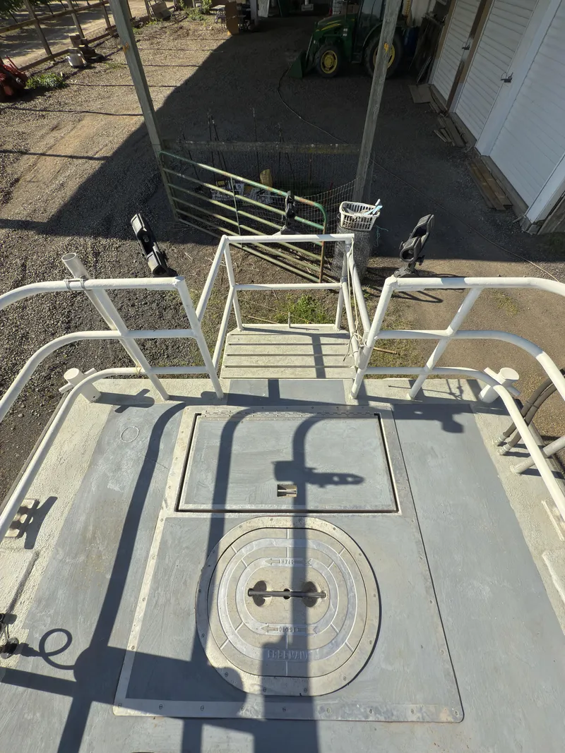 Slide: The Image of 1975 Monark 30 Fishing Boat deck with railing and hatch, viewed from above. - 34
