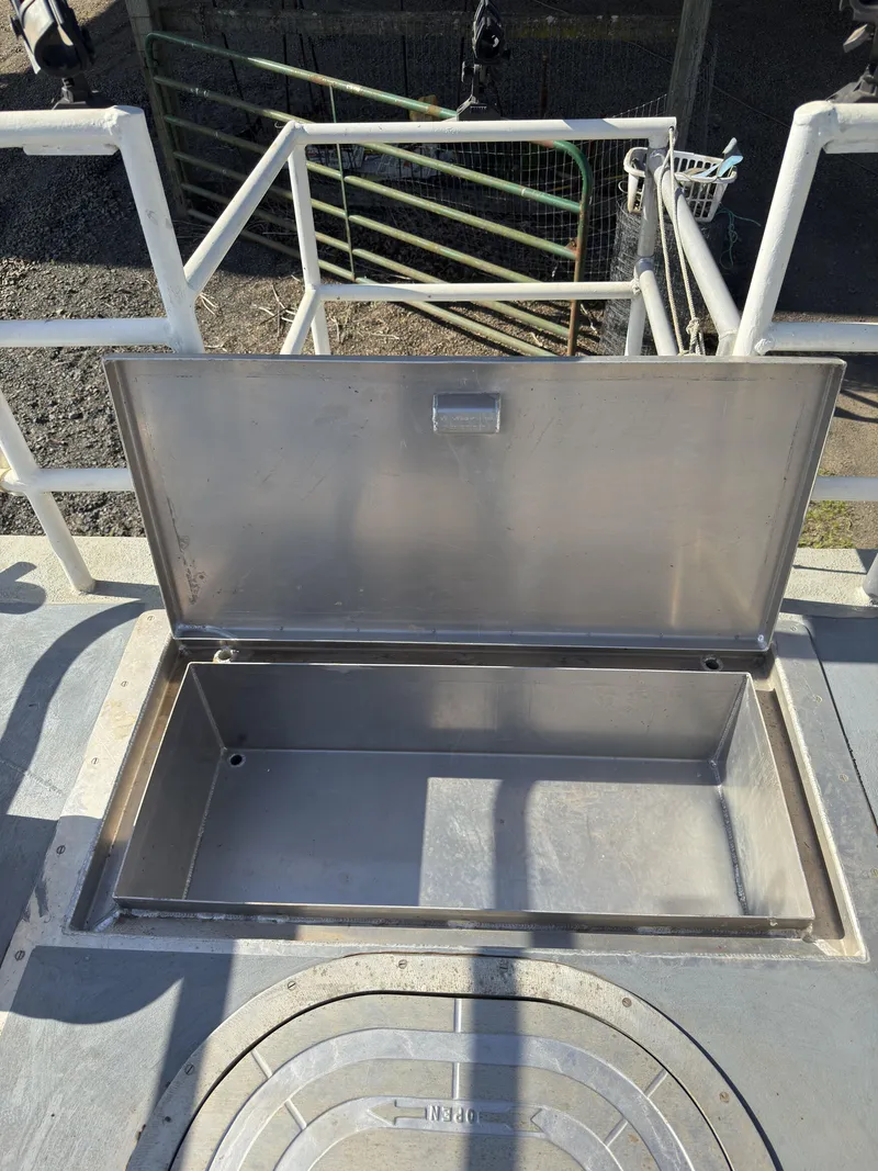 Slide: The Image of Open storage compartment on a 1975 Monark 30 Fishing Boat deck. - 35