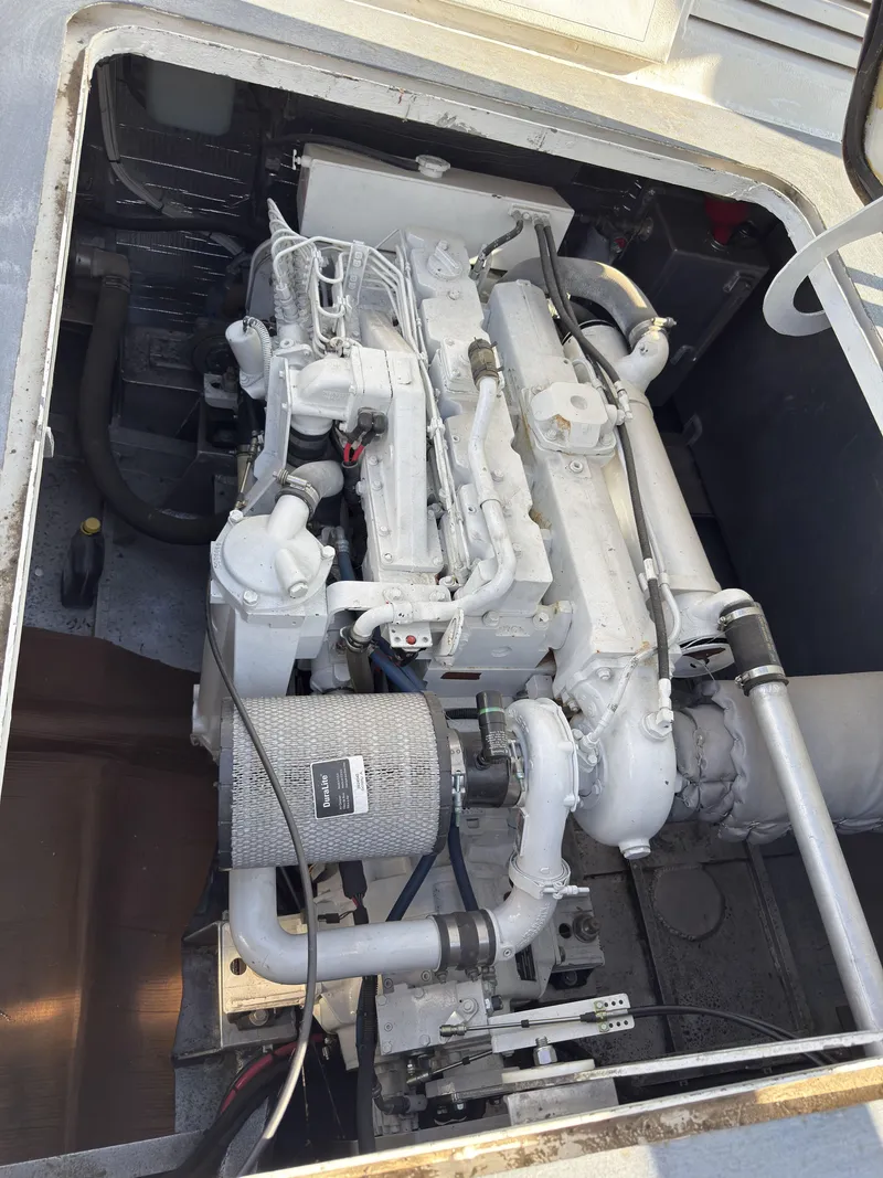 Slide: The Image of Engine compartment of a 1975 Monark 30 Fishing Boat, showcasing detailed machinery. - 36