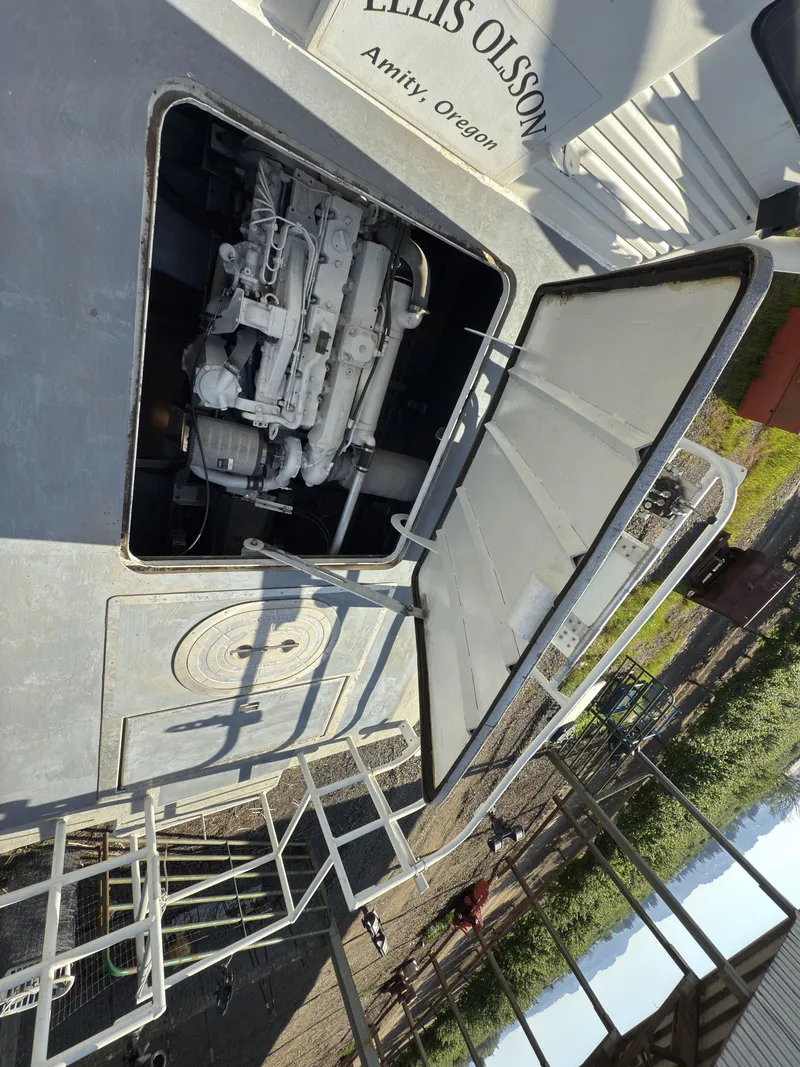 Slide: The Image of 1975 Monark 30 Fishing Boat engine compartment open, showing detailed machinery. - 37