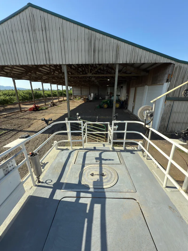 Slide: The Image of 1975 Monark 30 Fishing Boat docked near a wooden shed under clear blue skies. - 5