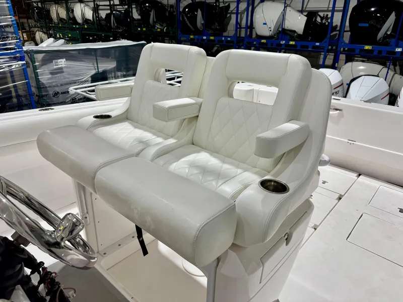 Slide: The Image of 2020 Intrepid 407 Nomad FE boat with white leather seating and armrests. - 10