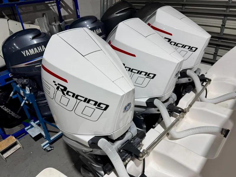 Slide: The Image of Triple Mercury Racing 300 outboard engines on a 2020 Intrepid 407 Nomad FE boat. - 15