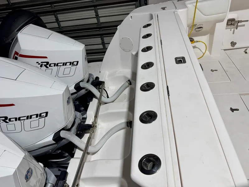 Slide: The Image of 2020 Intrepid 407 Nomad FE boat with dual racing engines in a garage setting. - 16