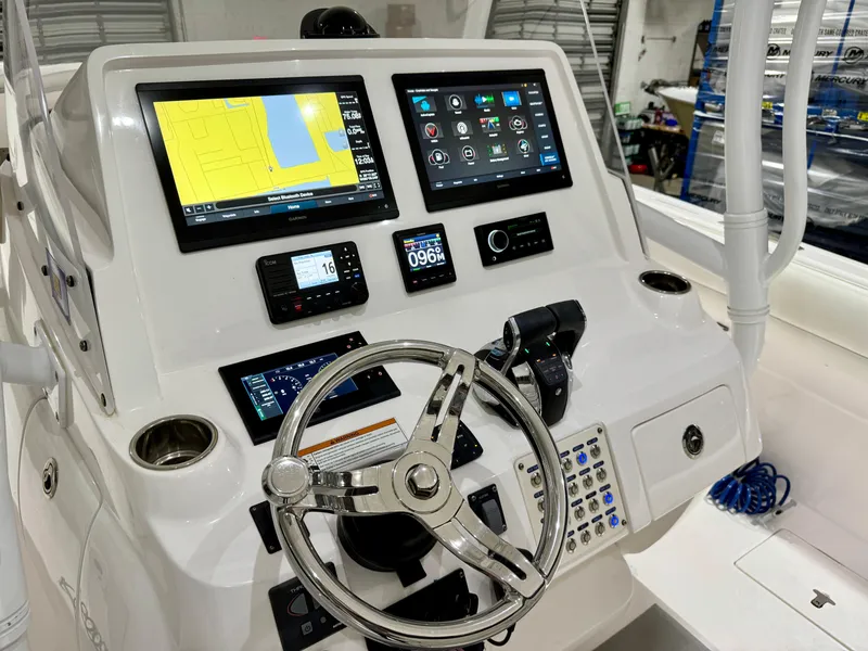 Slide: The Image of Control panel of 2020 Intrepid 407 Nomad FE boat with advanced navigation displays. - 18