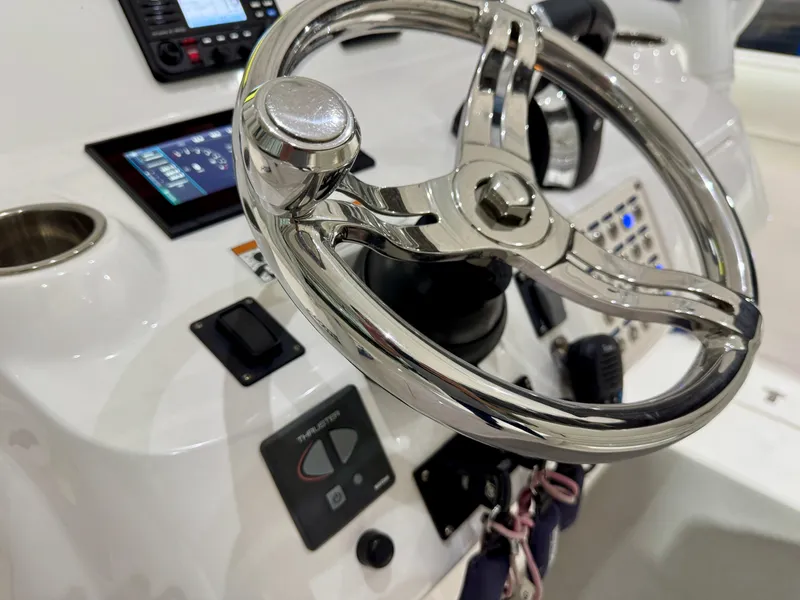 Slide: The Image of 2020 Intrepid 407 Nomad FE helm with chrome steering wheel and modern controls. - 20