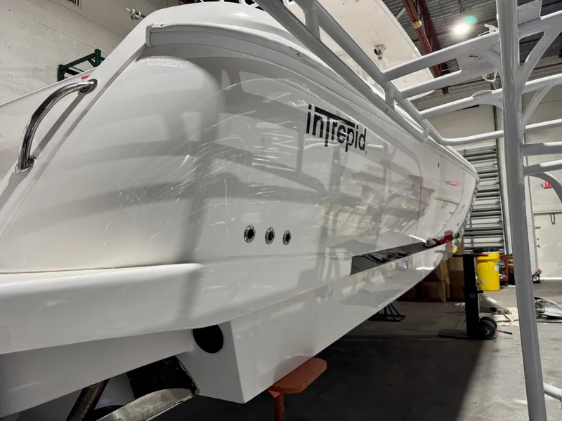 Slide: The Image of 2020 Intrepid 407 Nomad FE boat in a workshop setting. - 22