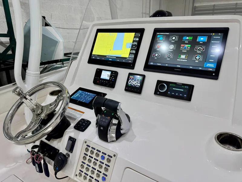 Slide: The Image of 2020 Intrepid 407 Nomad FE boat dashboard with advanced navigation and control systems. - 23