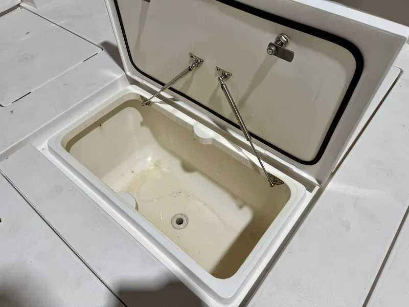 Slide: The Image of Open storage compartment on 2020 Intrepid 407 Nomad FE boat. - 27