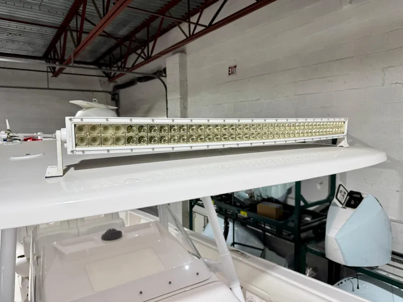 Slide: The Image of 2020 Intrepid 407 Nomad FE boat with mounted LED light bar in a garage. - 32