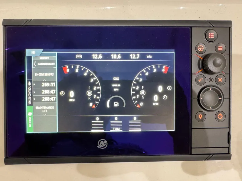 Slide: The Image of Digital dashboard of a 2020 Intrepid 407 Nomad FE boat, displaying engine metrics. - 33
