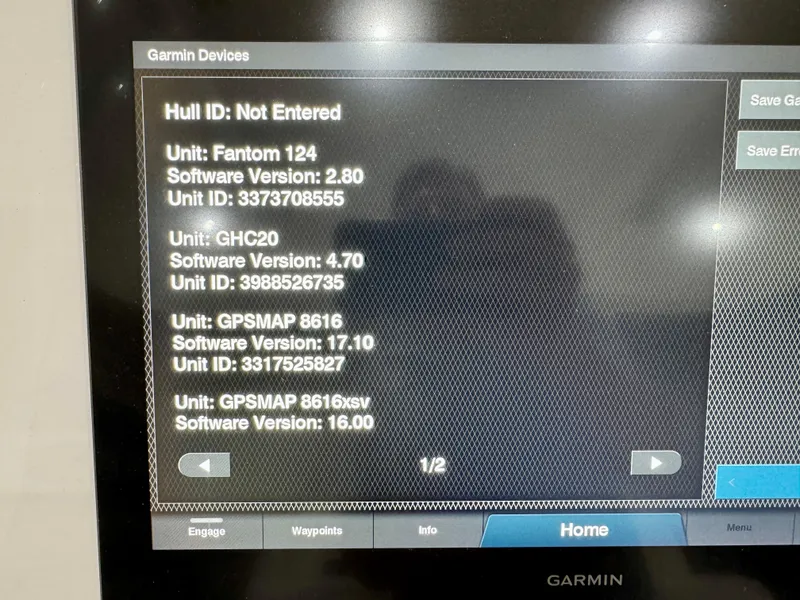 Slide: The Image of Garmin device screen displaying software versions for Intrepid 407 Nomad FE, 2020 model. - 34