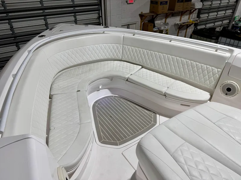 Slide: The Image of 2020 Intrepid 407 Nomad FE boat with luxurious white seating and quilted upholstery. - 7