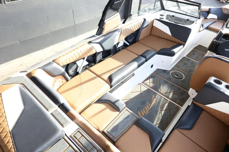 Slide: The Image of 2025 Tigé Z3 boat interior with luxurious tan and black seating, modern design. - 13
