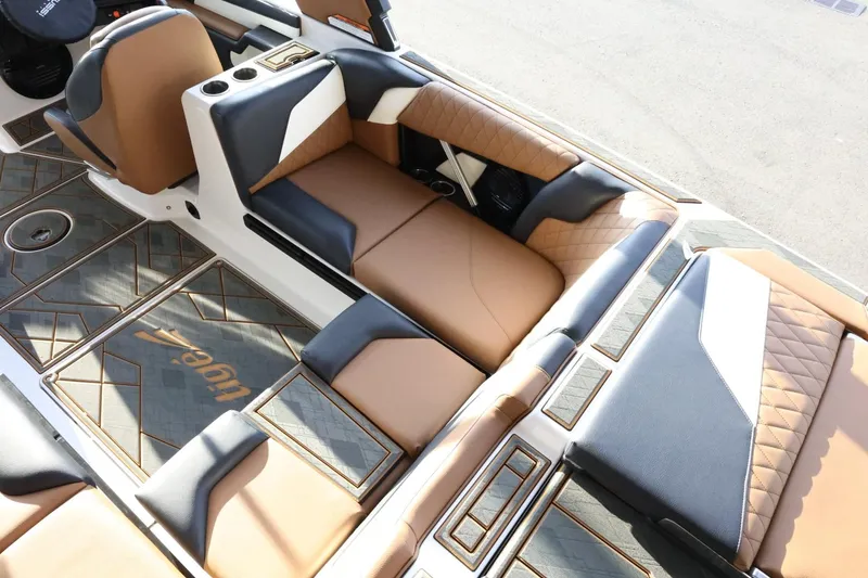 Slide: The Image of 2025 Tigé Z3 boat interior with luxurious brown and black seating and stylish design. - 14
