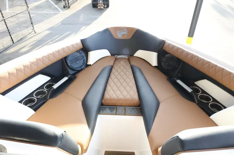 Slide: The Image of Luxurious interior of 2025 Tigé Z3 boat with brown and black seating. - 17