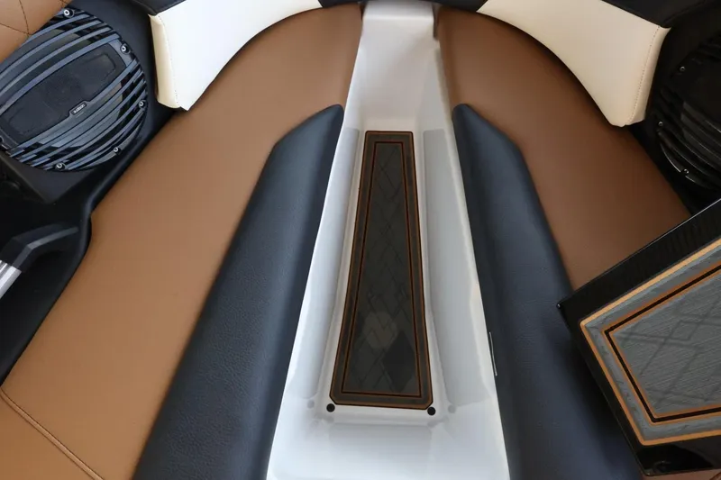 Slide: The Image of 2025 Tigé Z3 boat interior with brown and black seating, featuring modern speaker system. - 20
