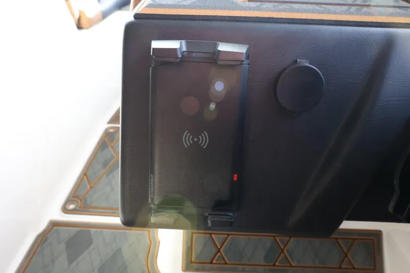 Slide: The Image of 2025 Tigé Z3 dashboard with wireless charging pad and sleek design. - 24