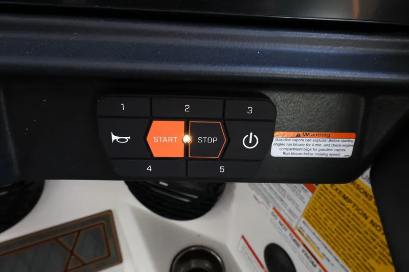 Slide: The Image of Dashboard controls of a 2025 Tigé Z3 boat, featuring start/stop and power buttons. - 25