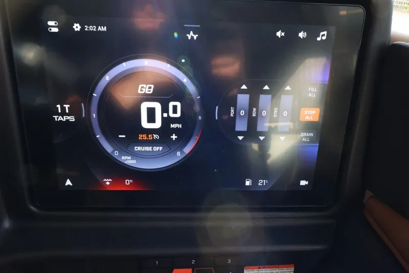 Slide: The Image of 2025 Tigé Z3 dashboard display showing speedometer and control settings. - 27