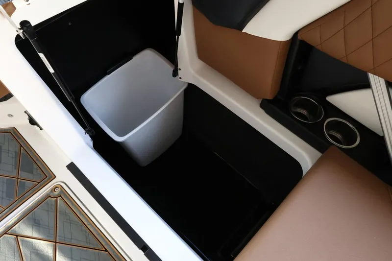 Slide: The Image of 2025 Tigé Z3 boat interior storage with trash bin and cup holders. - 34