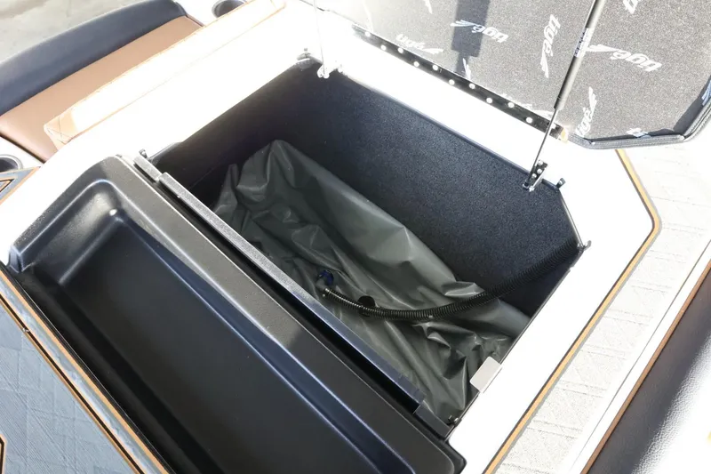 Slide: The Image of Open storage compartment in 2025 Tigé Z3 boat, featuring spacious interior and sleek design. - 39