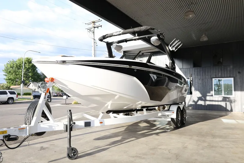 Slide: The Image of 2025 Tigé Z3 boat on trailer, parked indoors, showcasing sleek design and modern features. - 4