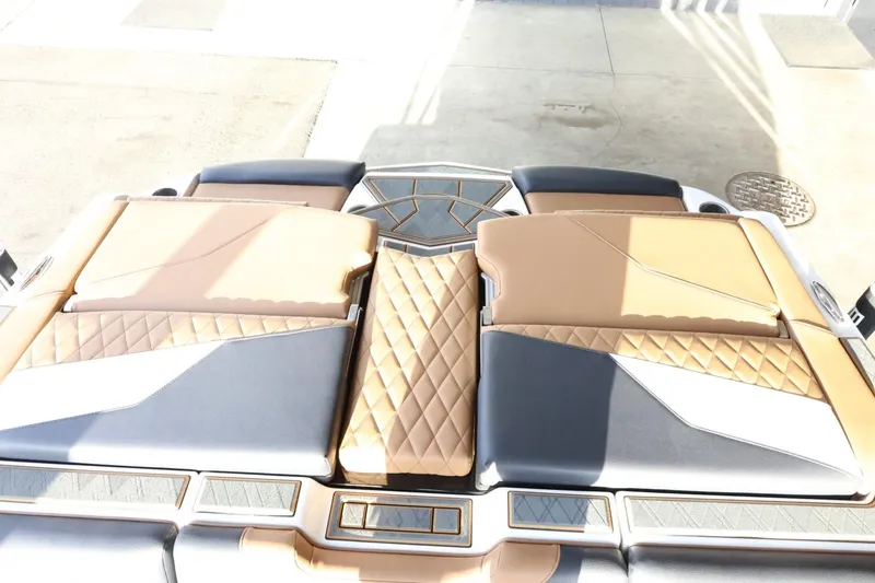 Slide: The Image of 2025 Tigé Z3 boat interior with luxurious tan and gray seating design. - 41