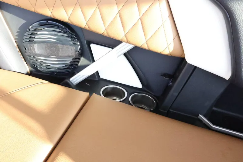 Slide: The Image of 2025 Tigé Z3 interior with tan leather, speaker, and cup holders. - 43