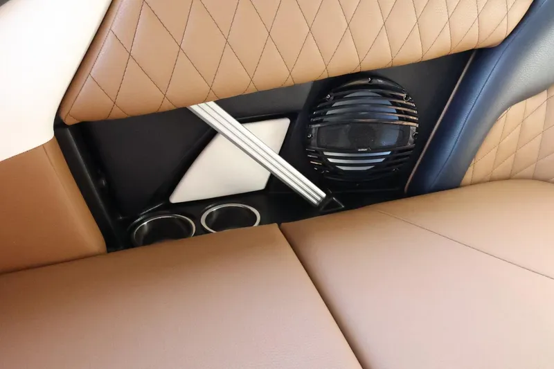 Slide: The Image of 2025 Tigé Z3 interior with tan quilted seats, speaker, and cup holders. - 44