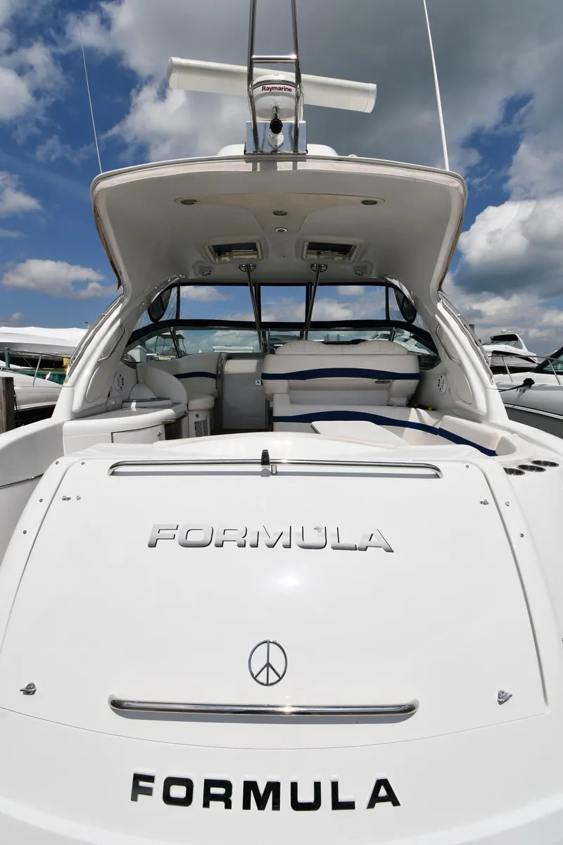 Slide: The Image of 2009 Formula 40 PC yacht, rear view, showcasing sleek design and branding. - 10