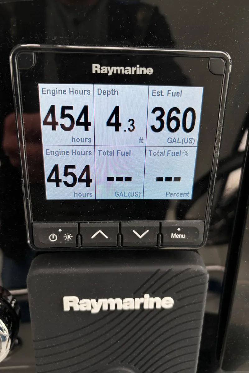 Slide: The Image of Raymarine display showing engine hours, depth, and estimated fuel for 2009 Formula 40 PC. - 15