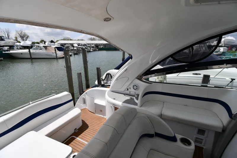 Slide: The Image of 2009 Formula 40 PC yacht interior with white seating, docked at marina. - 25