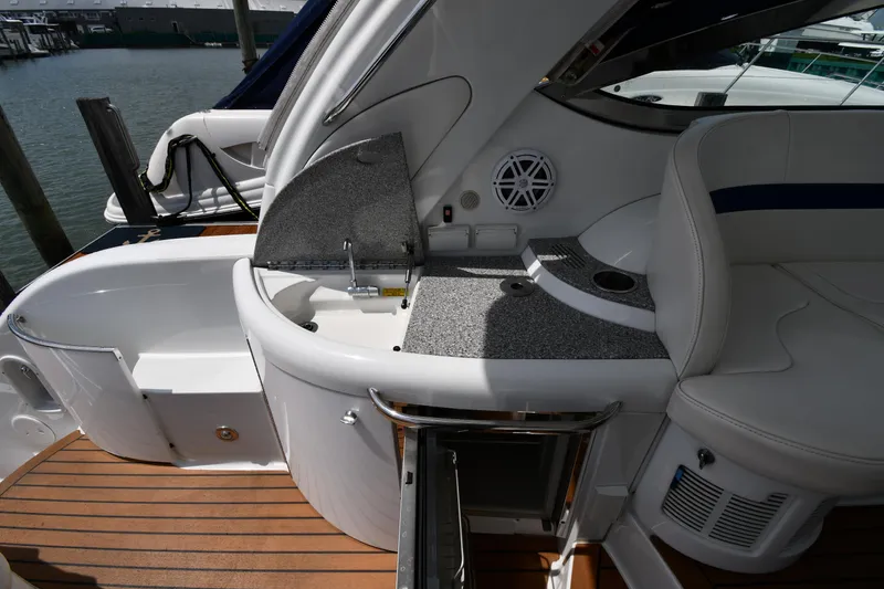 Slide: The Image of 2009 Formula 40 PC yacht interior with seating and kitchenette on deck. - 27