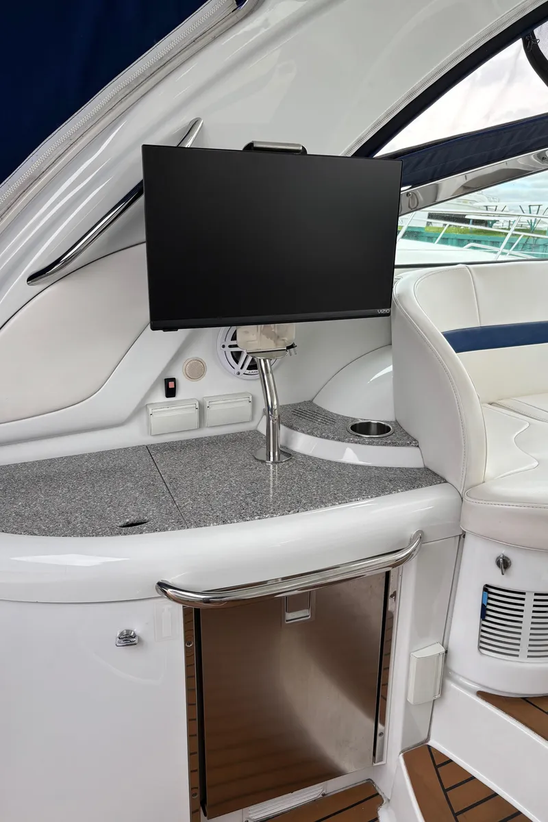Slide: The Image of 2009 Formula 40 PC yacht interior with mounted TV and sleek design. - 28