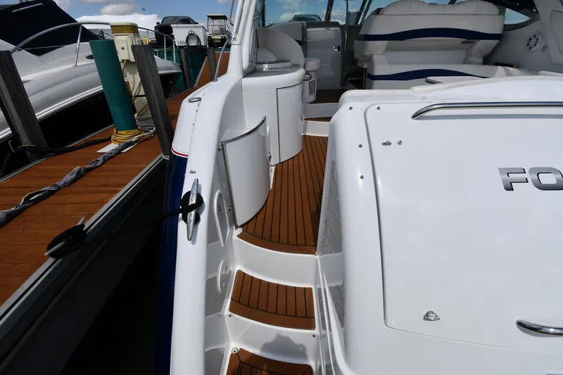 Slide: The Image of 2009 Formula 40 PC yacht with teak deck, docked at marina. - 29