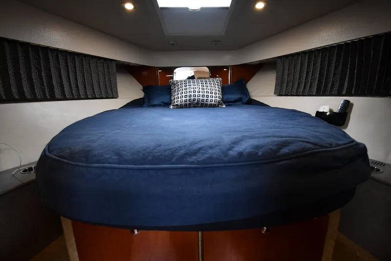 Slide: The Image of Luxurious cabin interior of a 2009 Formula 40 PC yacht with a cozy bed. - 35
