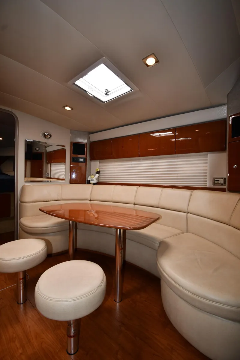 Slide: The Image of 2009 Formula 40 PC yacht interior with elegant seating and wooden table. - 41
