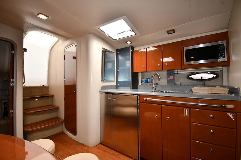 Slide: The Image of 2009 Formula 40 PC yacht interior with modern kitchen and wooden cabinetry. - 44