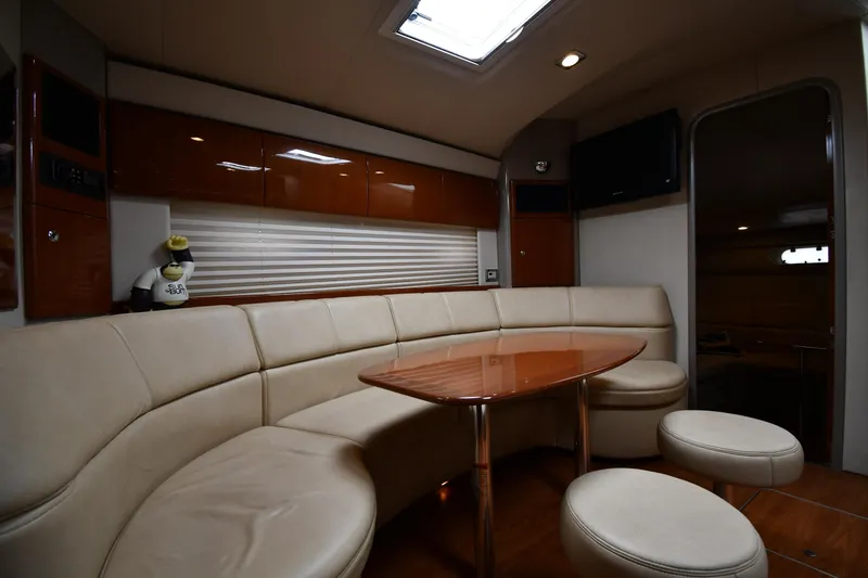 Slide: The Image of Luxurious 2009 Formula 40 PC yacht interior with plush seating and elegant wooden table. - 46