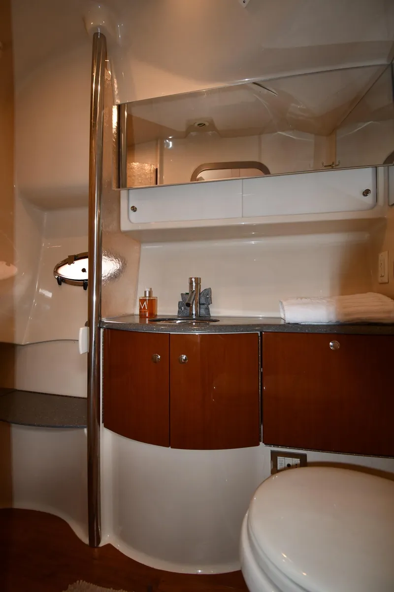 Slide: The Image of 2009 Formula 40 PC yacht bathroom with modern fixtures and wooden cabinetry. - 49