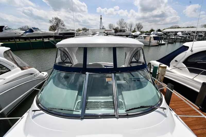 Slide: The Image of 2009 Formula 40 PC yacht docked at marina under cloudy sky. - 5