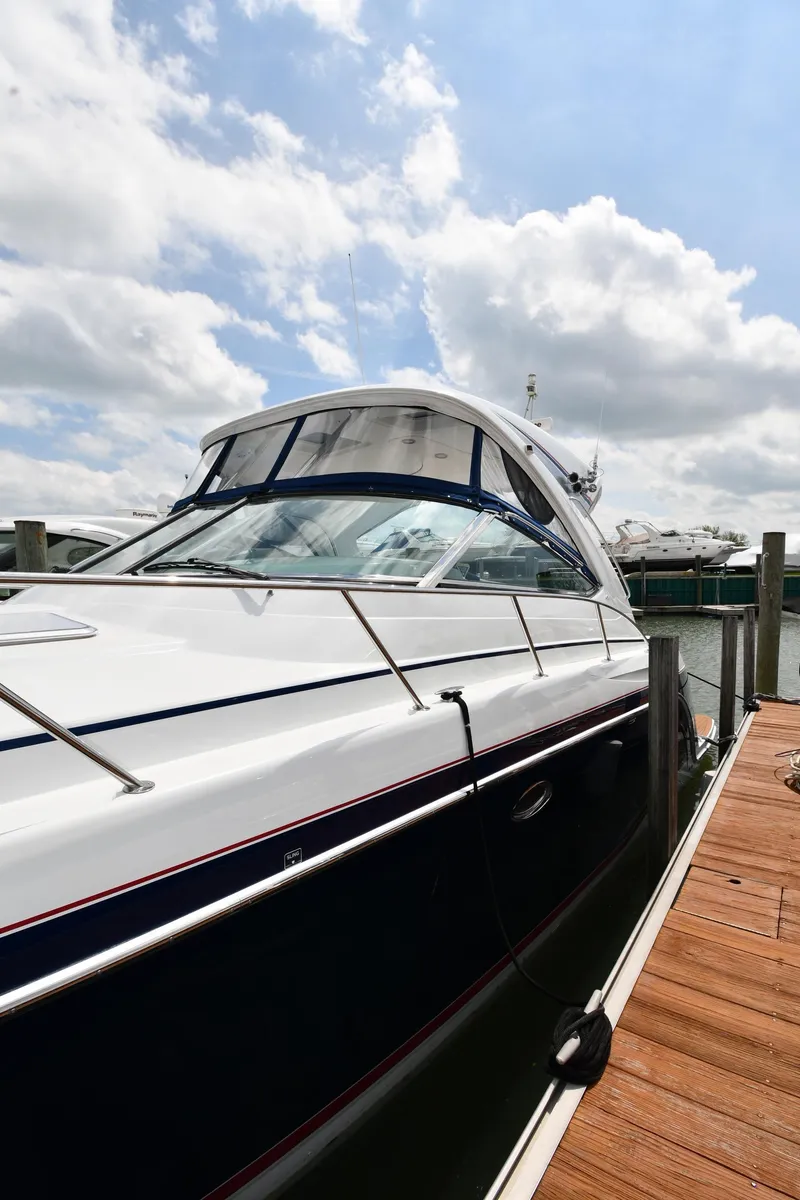 Slide: The Image of 2009 Formula 40 PC yacht docked under a partly cloudy sky. - 6