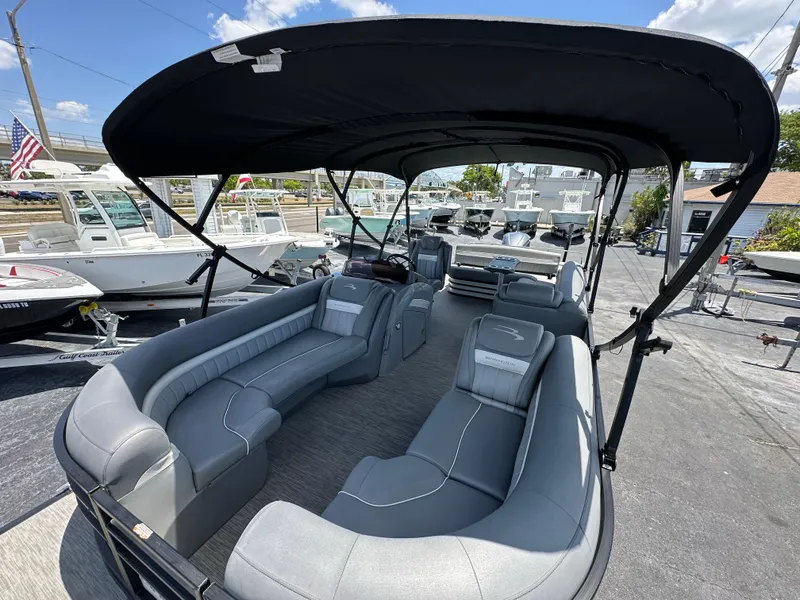 Slide: The Image of 2021 Bennington LX 24 Stern Lounge pontoon boat with spacious seating and canopy. - 21