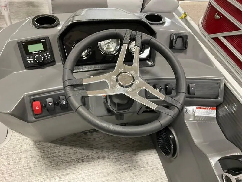Slide: The Image of Steering console of 2025 Bennington 23SSR-SPS (PB) boat with modern controls and gauges. - 12
