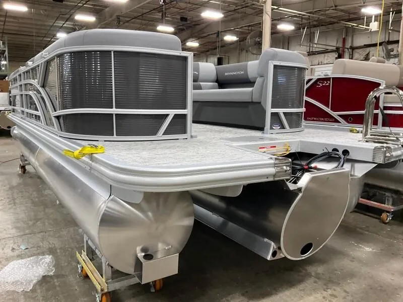 Slide: The Image of 2025 Bennington 23SSR-SPS pontoon boat in a warehouse setting. - 17