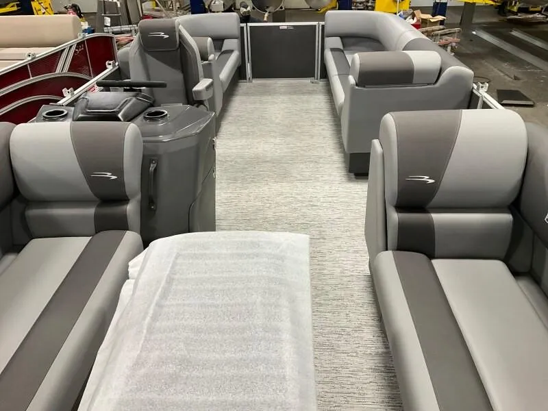 Slide: The Image of 2025 Bennington 23SSR-SPS pontoon boat interior with gray seating and modern design. - 5