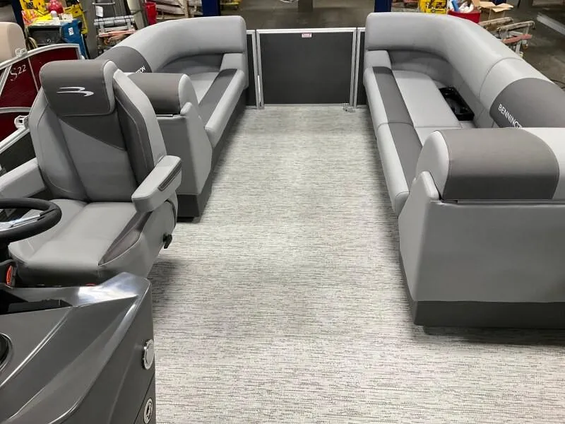 Slide: The Image of 2025 Bennington 23SSR-SPS (PB) pontoon boat interior with gray seating and helm. - 8
