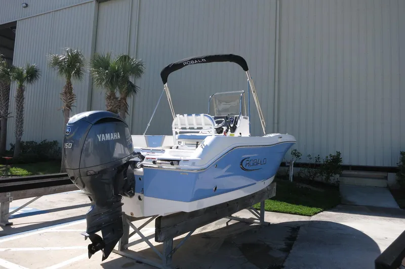 Slide: The Image of 2025 Robalo R180 Center Console boat with Yamaha engine, displayed outdoors. - 15