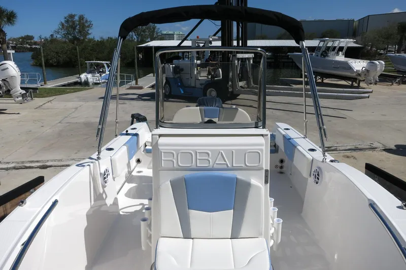 Slide: The Image of 2025 Robalo R180 Center Console boat with sleek design and spacious seating. - 23